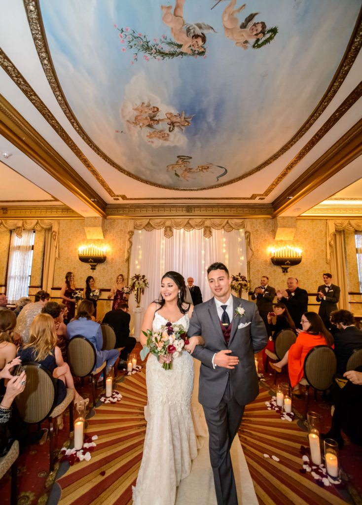 wedding ceremony in the onyx room at brown palace