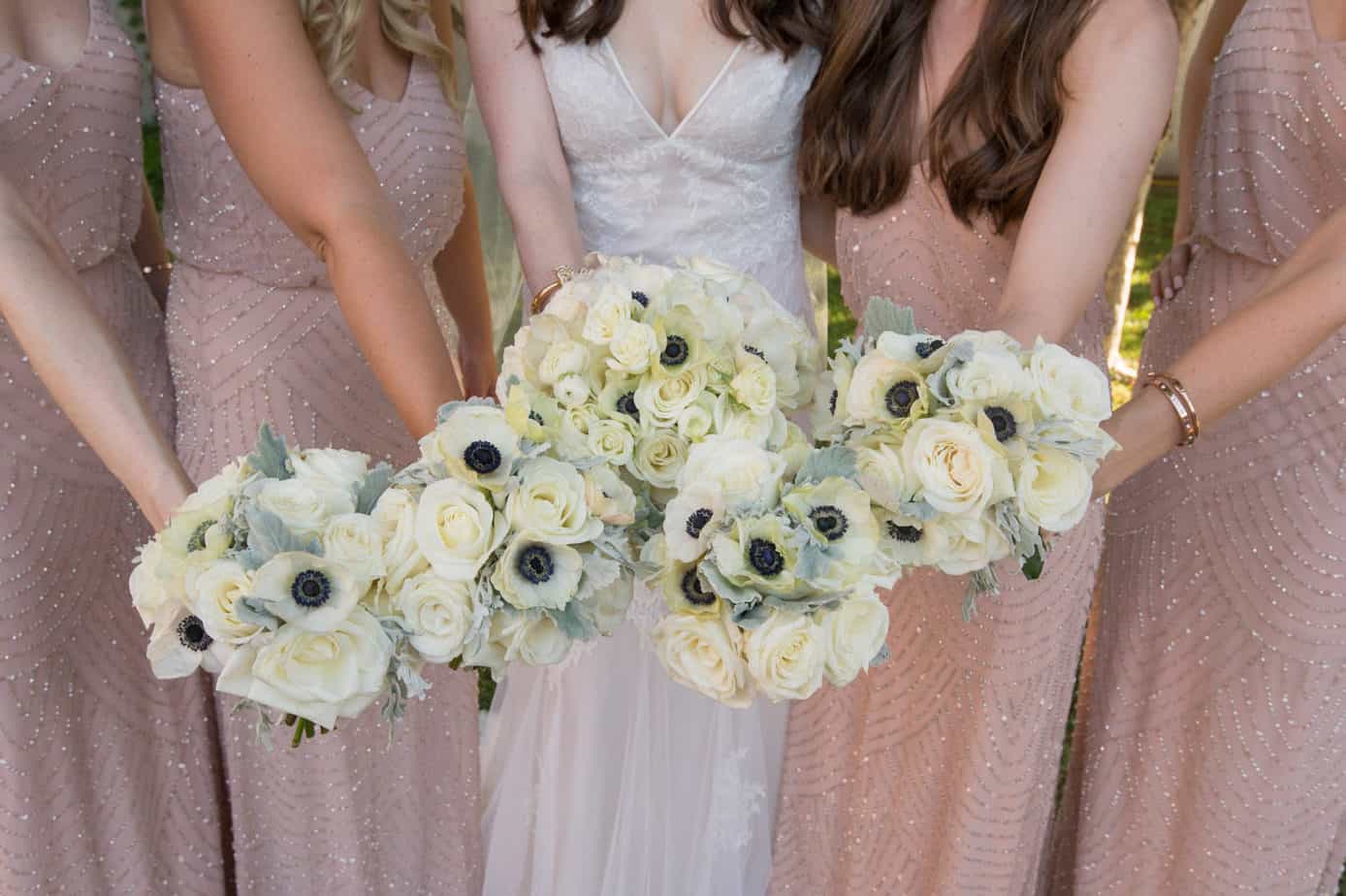 blush bridesmaids and ivory bouquets