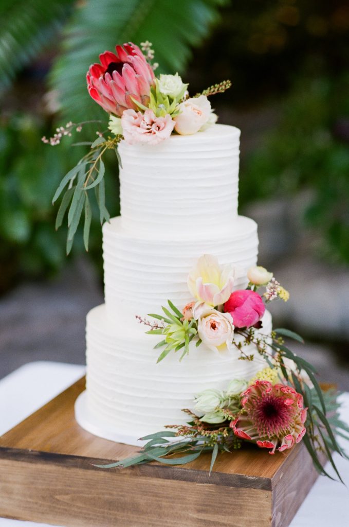 Wedding cake with adorned flowers.