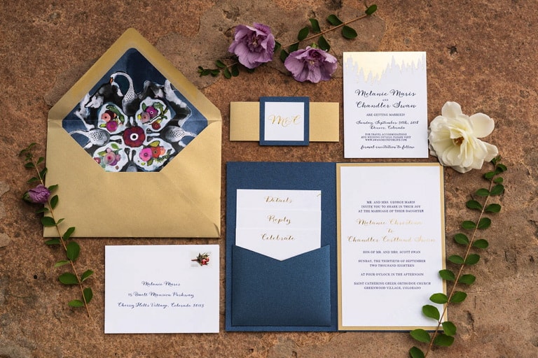 Invitation suite featuring Swan artwork in navy, white, and gold.