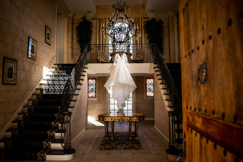 Wedding dress showcased at Castle Cliff Estate for a winter wedding